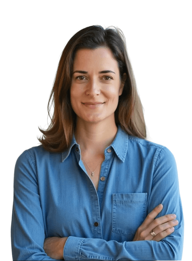 Person smiling in blue shirt with folded arms.